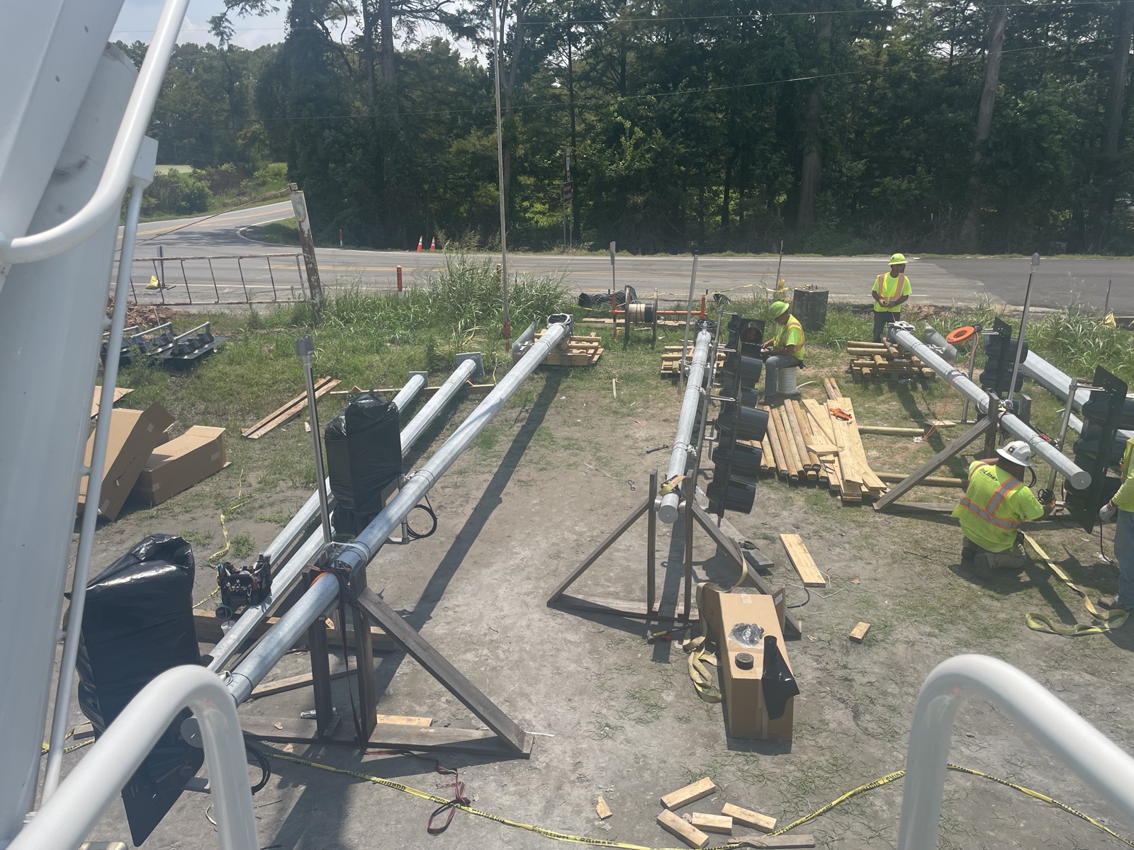 Traffic signal mast arm assembly work beside the Highway 391 corridor