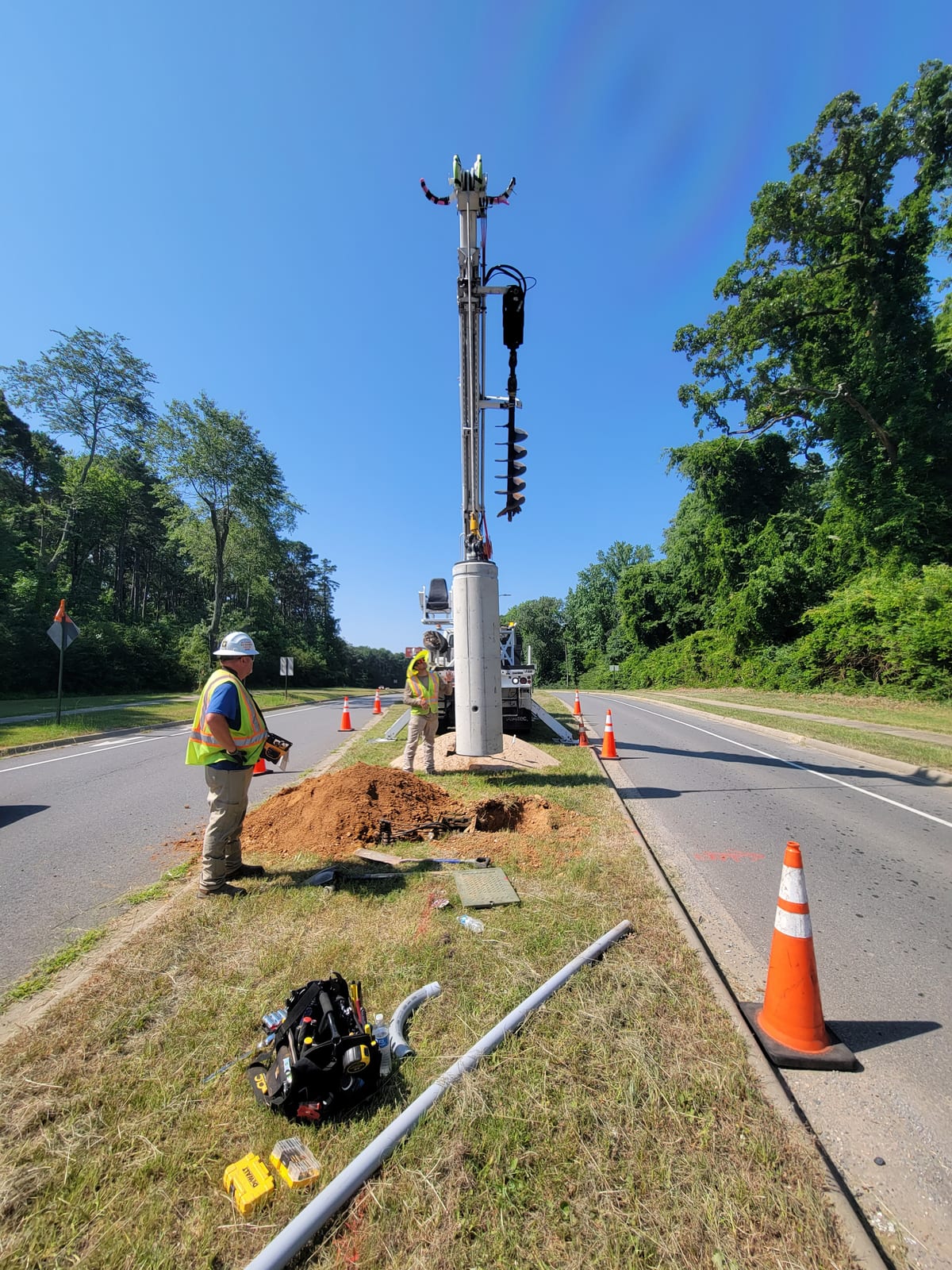 InLine crew setting a precast lighting foundation in the City of Bryant median
