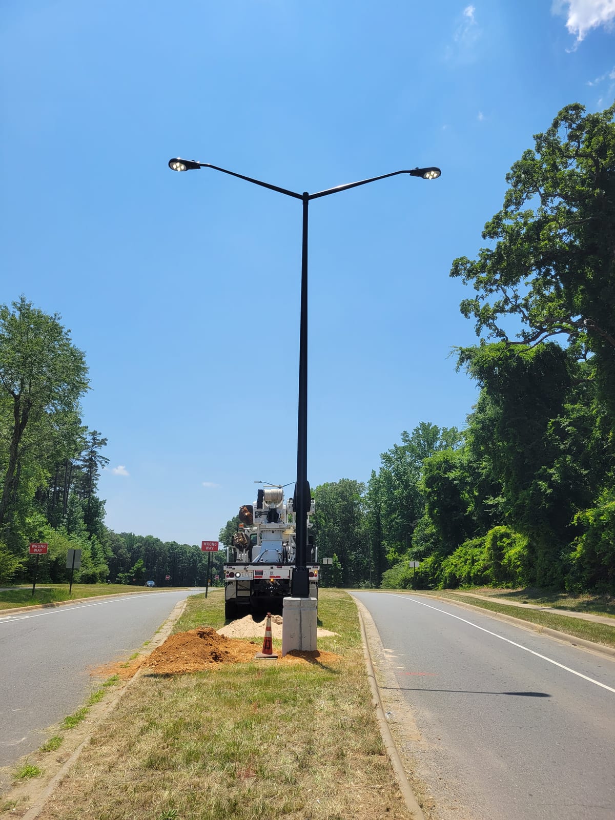 Completed double-arm LED roadway light in the City of Bryant median