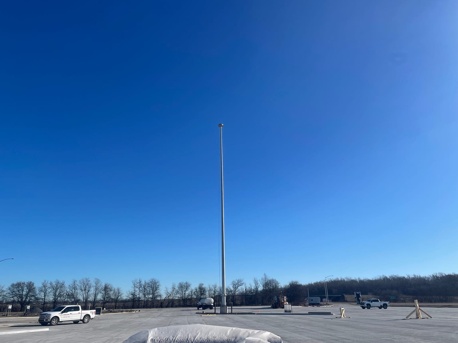 Completed high-mast lighting pole standing over the I-40 truck parking area