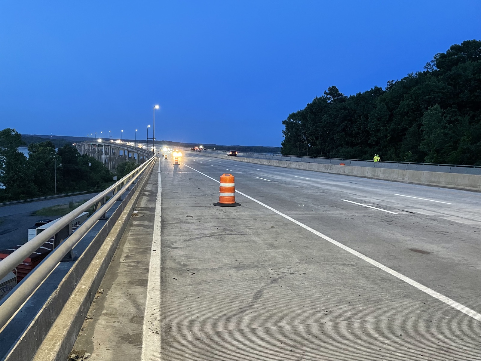 Completed roadway lighting across the I-430 bridge at dusk