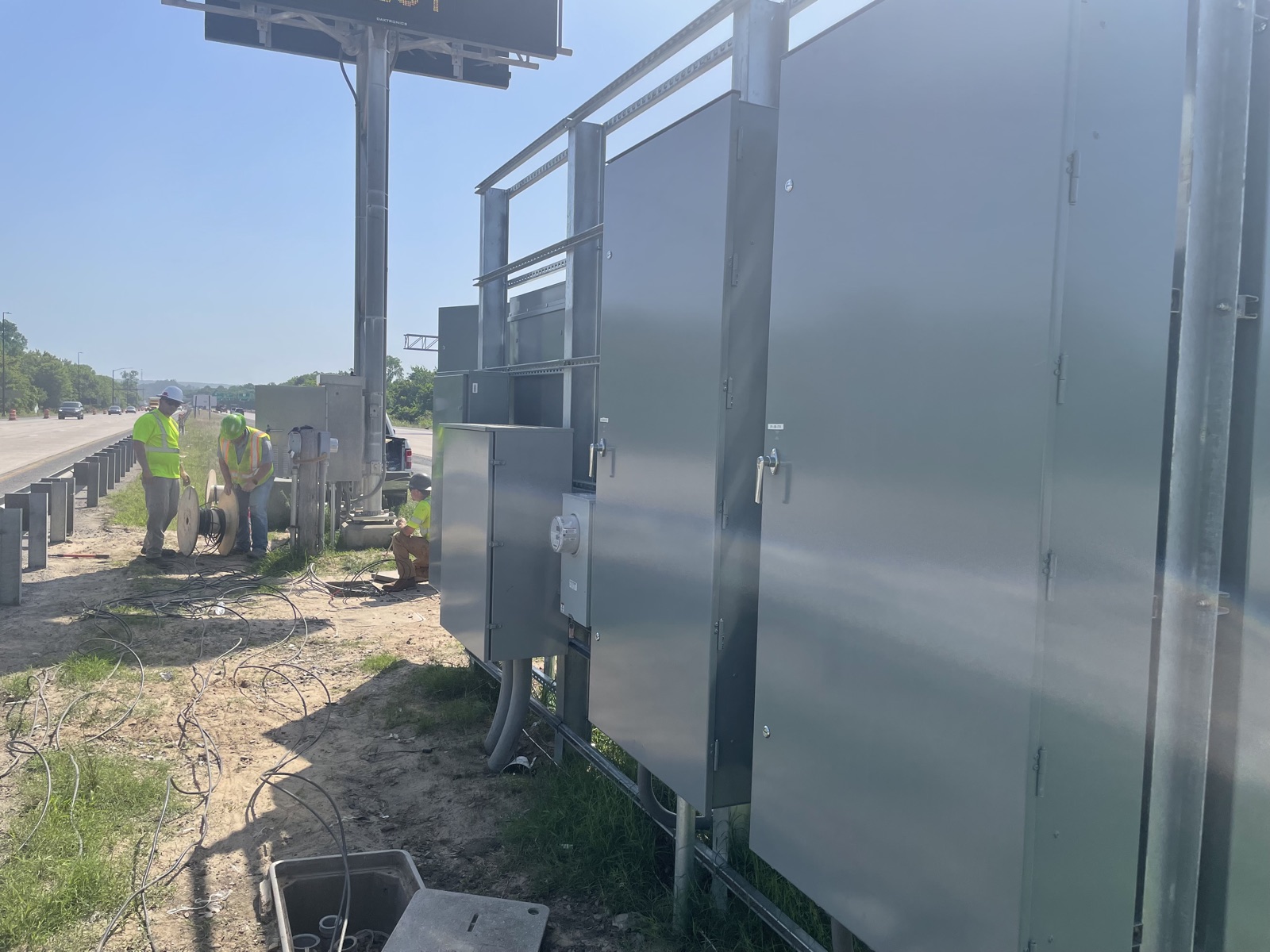 InLine crews wiring DMS power cabinets along I-430