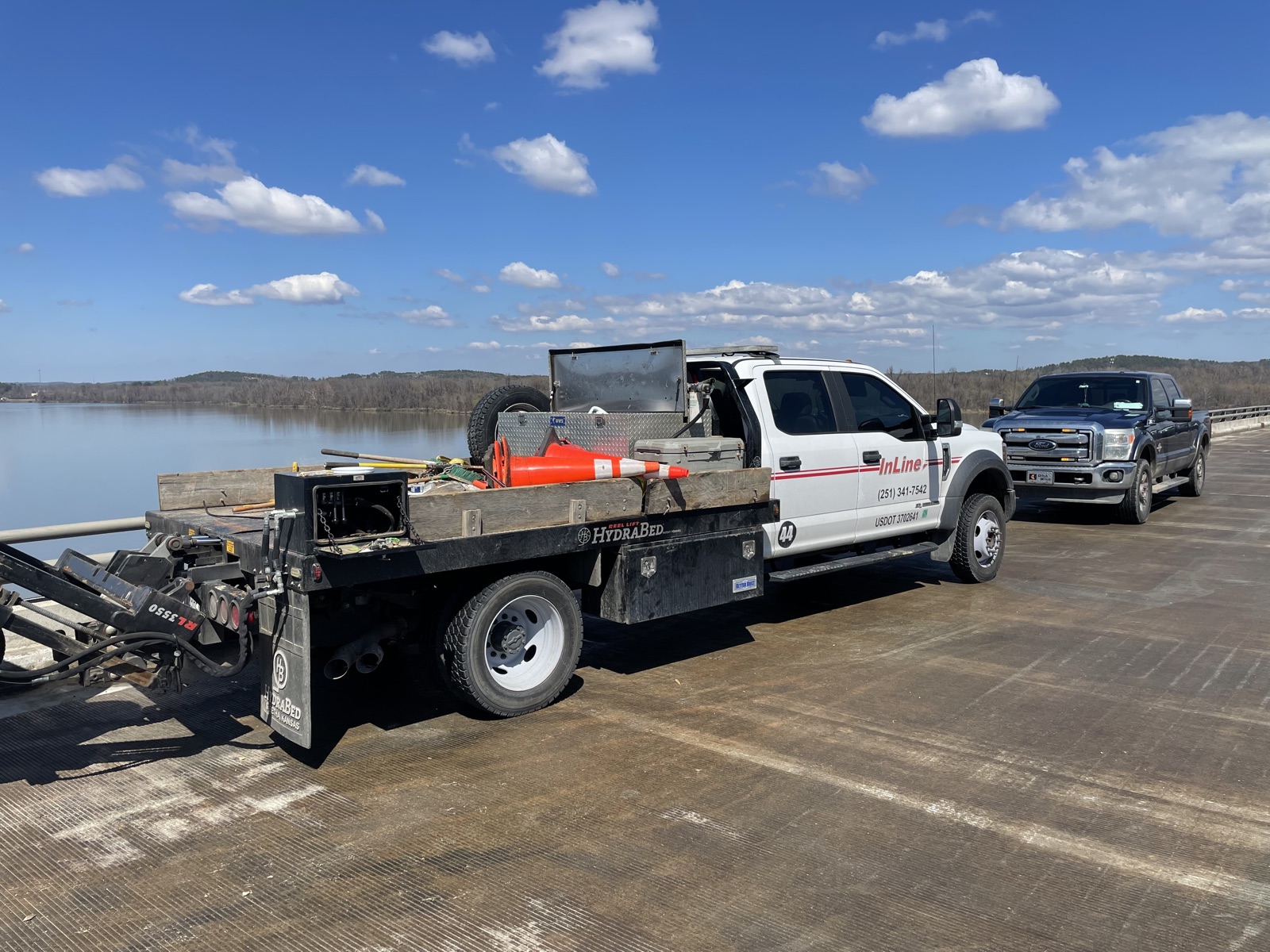 InLine trucks supporting fiber installation on the I-430 bridge