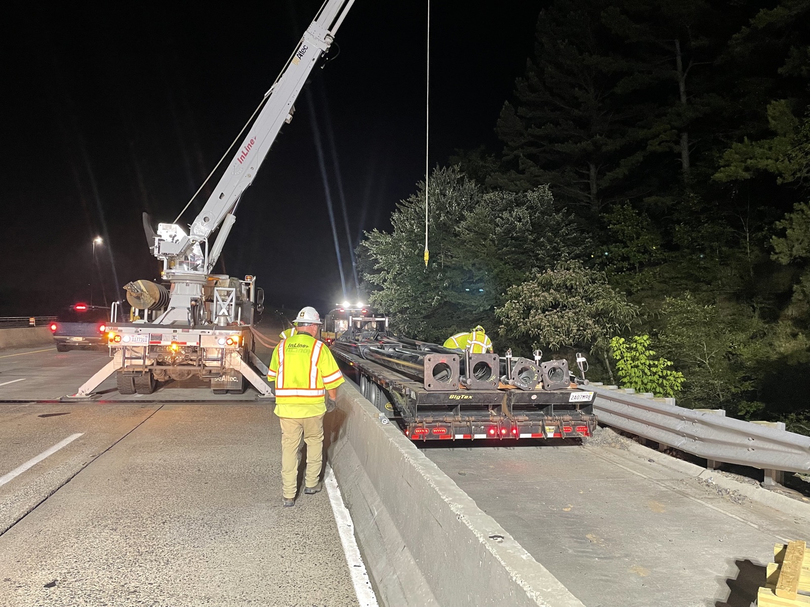 Night crews staging ITS poles for installation along I-430